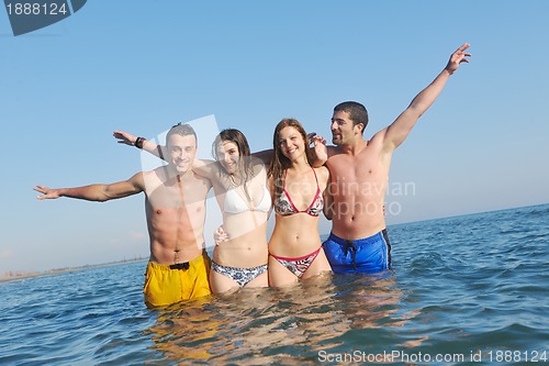 Image of happy young  people group have fun on beach