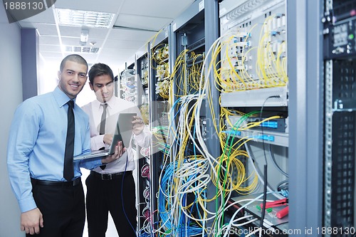 Image of it engineers in network server room