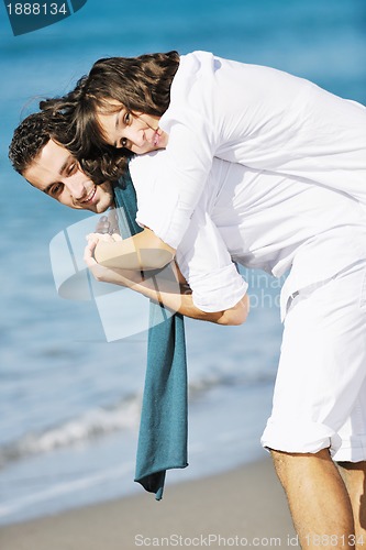 Image of happy young couple have fun at beautiful beach