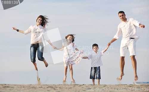 Image of happy young family have fun on beach