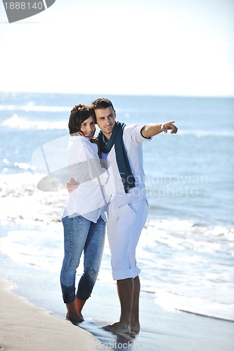 Image of happy young couple have fun at beautiful beach