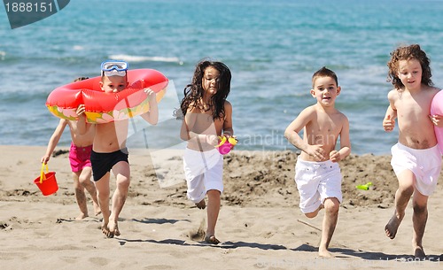 Image of child group have fun and play with beach toys