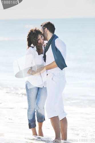 Image of happy young couple have fun at beautiful beach