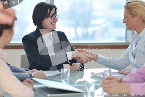 Image of young business woman on meeting