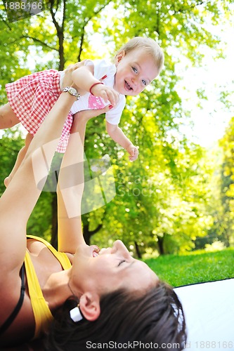 Image of woman and baby have playing at park