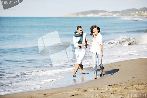 Image of happy young couple have fun at beautiful beach