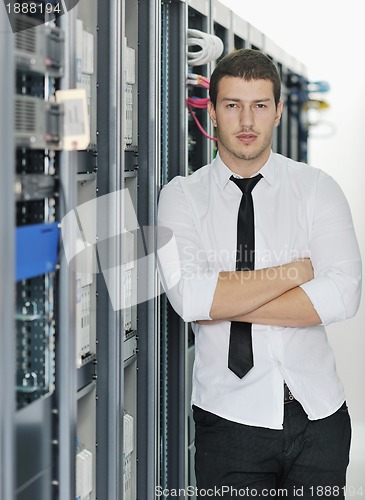 Image of young it engeneer in datacenter server room