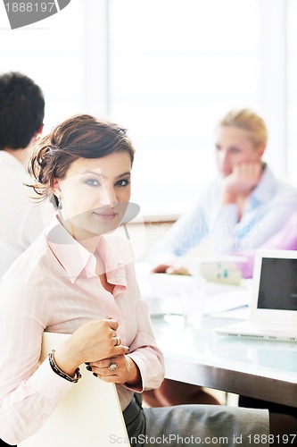 Image of young business woman on meeting