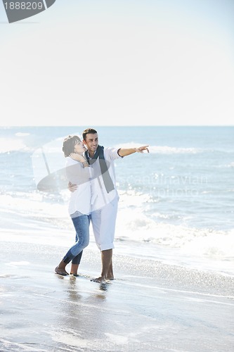 Image of happy young couple have fun at beautiful beach