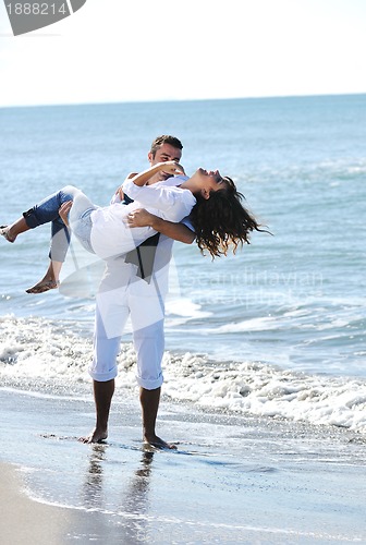 Image of happy young couple have fun at beautiful beach