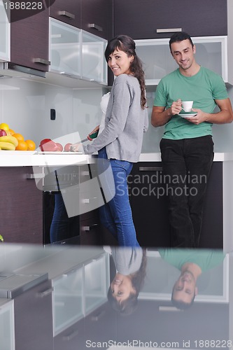 Image of young couple have fun in modern kitchen