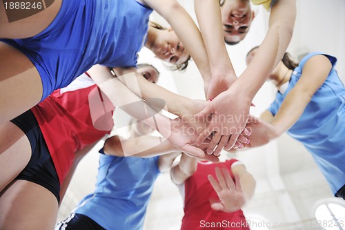 Image of girls playing volleyball indoor game