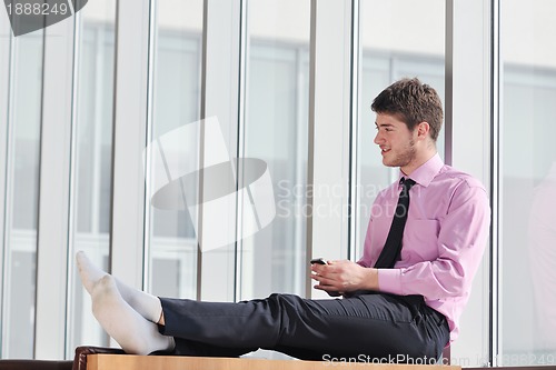 Image of young business man talk by cellphone