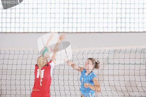 Image of girls playing volleyball indoor game