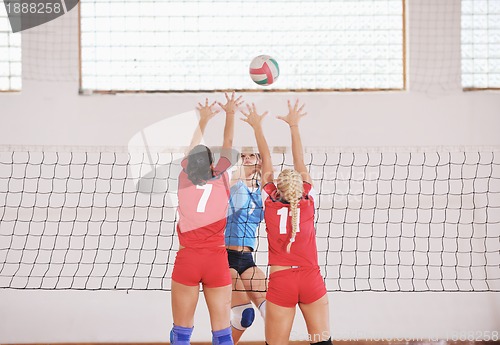 Image of girls playing volleyball indoor game