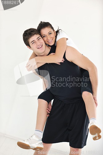 Image of happy young couple fitness workout and fun