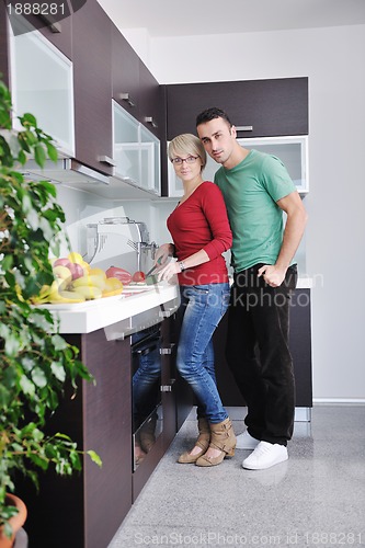 Image of young couple have fun in modern kitchen