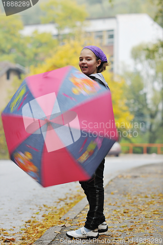 Image of happy girl with umbrella