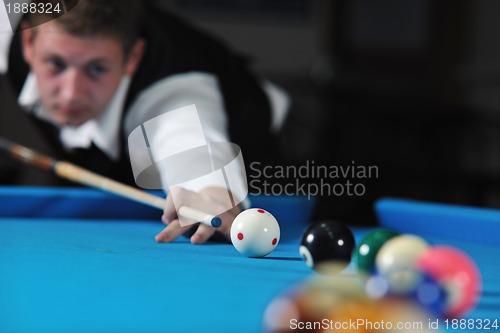 Image of young man play pro billiard game 