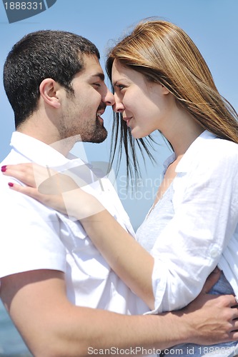 Image of happy young couple have fun on beach