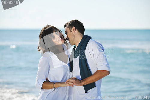 Image of happy young couple have fun at beautiful beach