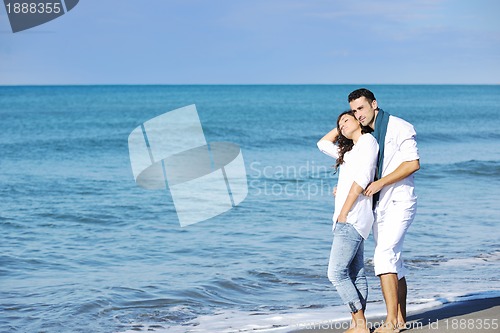 Image of happy young couple have fun at beautiful beach