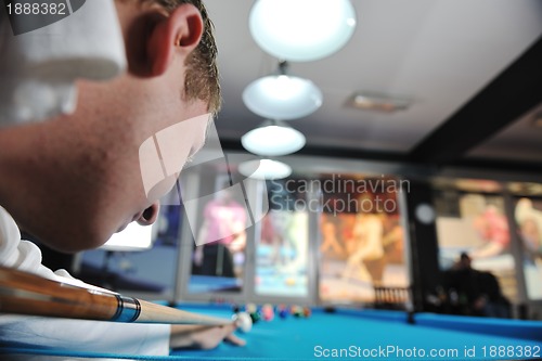 Image of young man play pro billiard game 