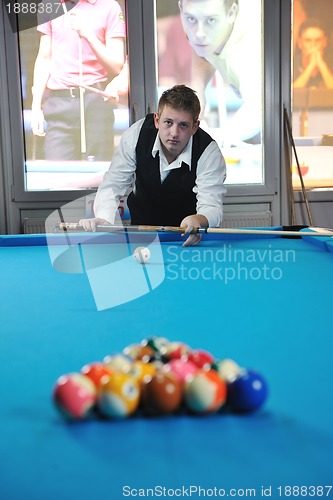 Image of young man play pro billiard game 