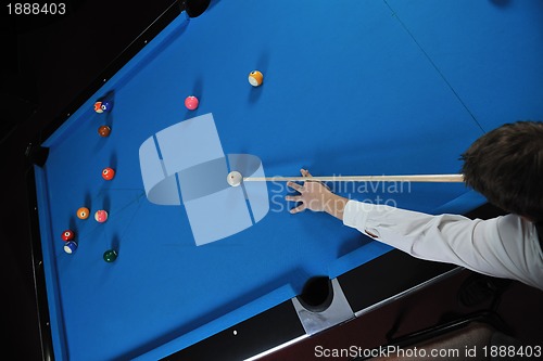 Image of young man play pro billiard game 