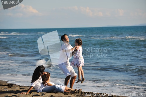 Image of happy young  family have fun on beach