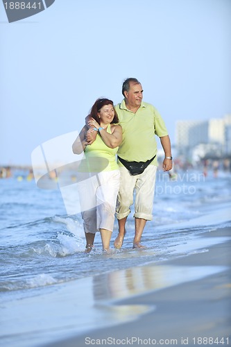 Image of happy seniors couple  on beach