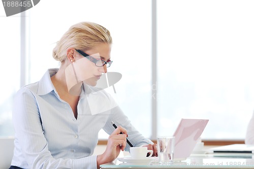 Image of young business woman on meeting