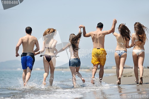 Image of happy young  people group have fun on beach