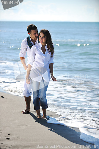 Image of happy young couple have fun at beautiful beach