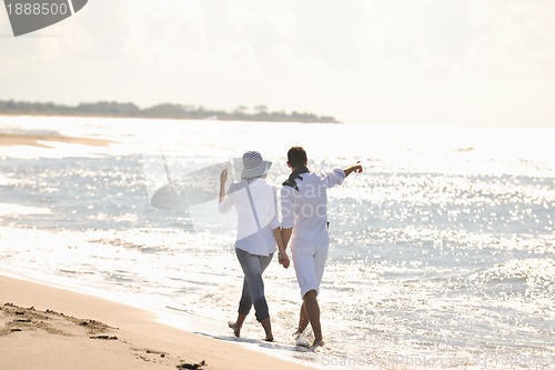 Image of happy young couple have fun at beautiful beach