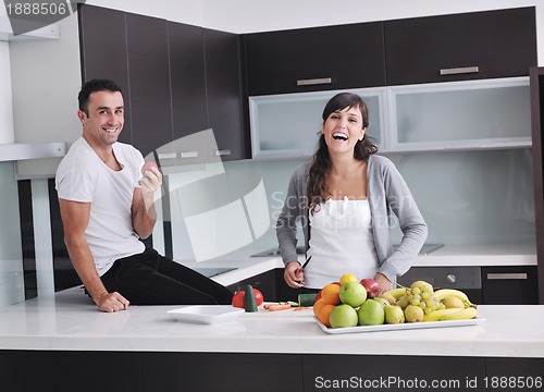 Image of young couple have fun in modern kitchen