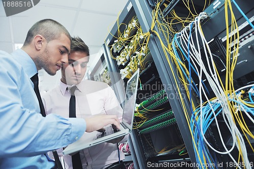 Image of it engineers in network server room