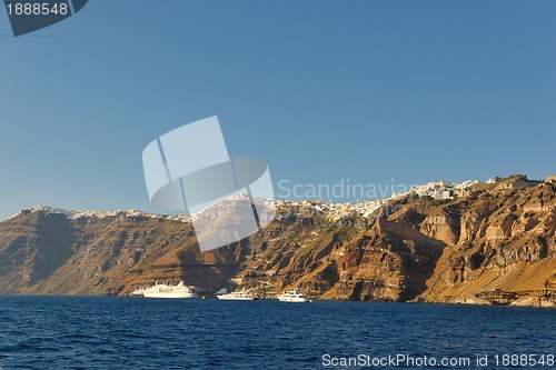 Image of santorini island coast with luxury yacht