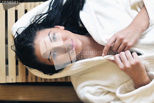 Image of Young woman take a steam bath