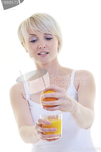 Image of Young woman squeeze orange juice