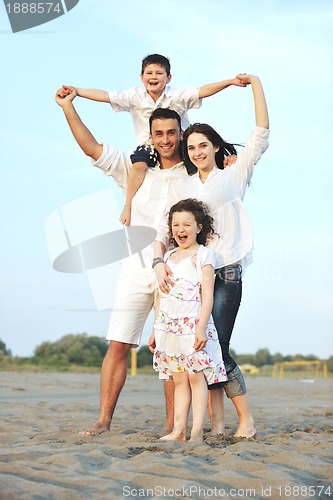 Image of happy young family have fun on beach