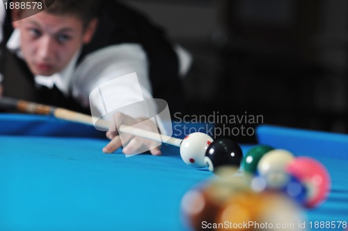 Image of young man play pro billiard game 