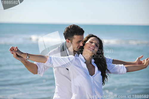 Image of happy young couple have fun at beautiful beach