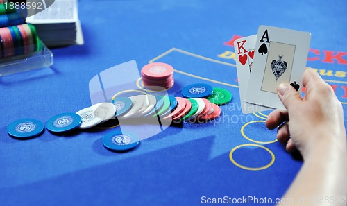 Image of woman play black jack card game in casino