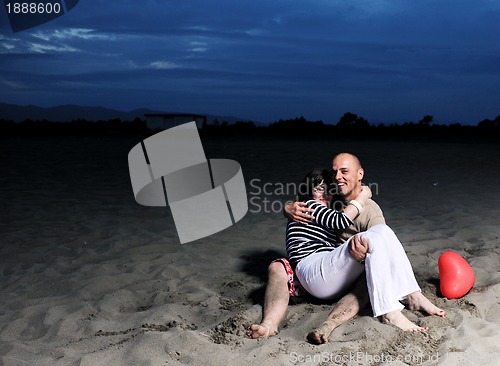 Image of happy young couple have fun on beach