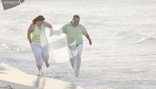 Image of happy seniors couple  on beach