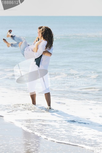 Image of happy young couple have fun at beautiful beach