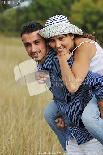 Image of happy young couple have romantic time outdoor