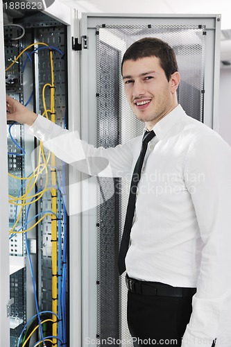 Image of young it engeneer in datacenter server room