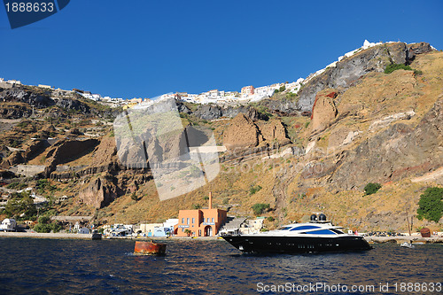 Image of santorini island coast with luxury yacht